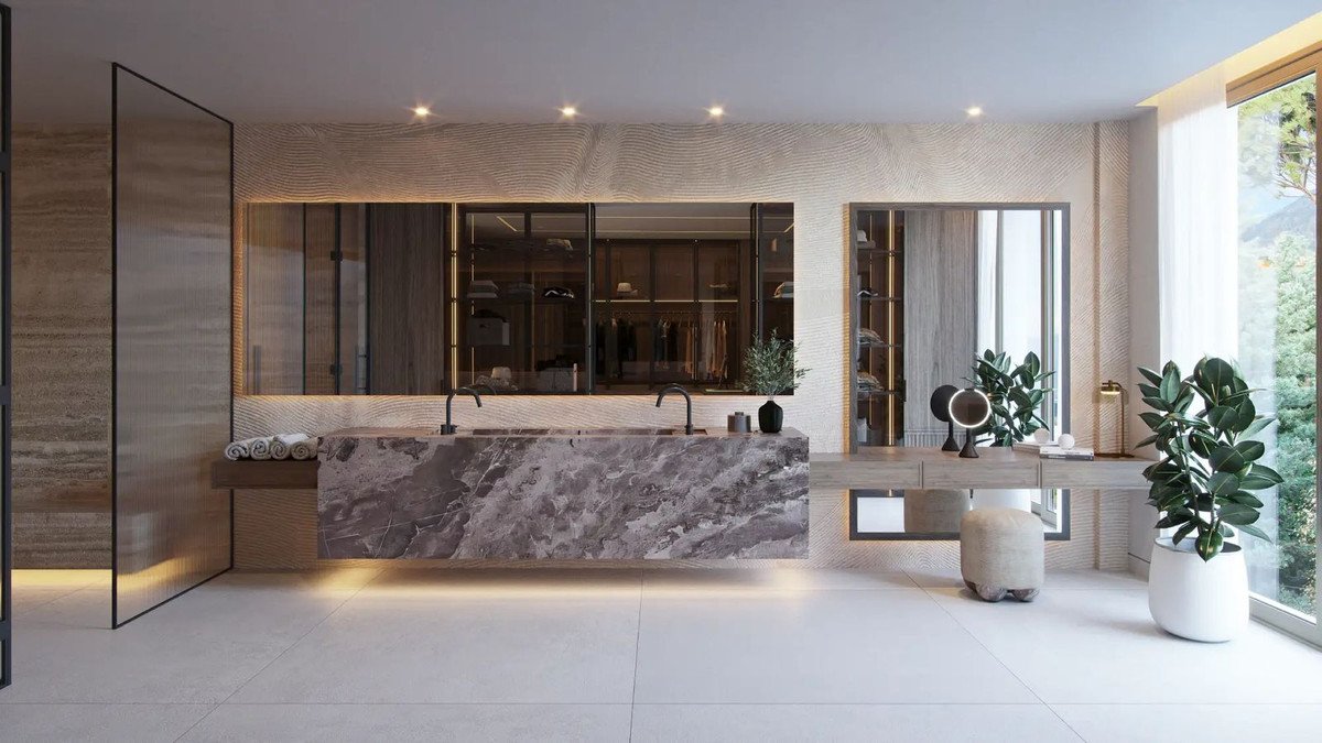Luxurious modern bathroom with a floating dual vanity, walk-in closet, and large windows with natural light.