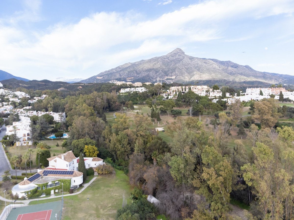 Aerial view of a villa with mountain and landscape views