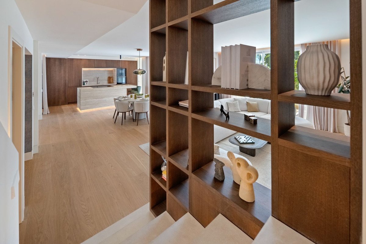 Modern open-plan living area with kitchen, dining, and living spaces visible