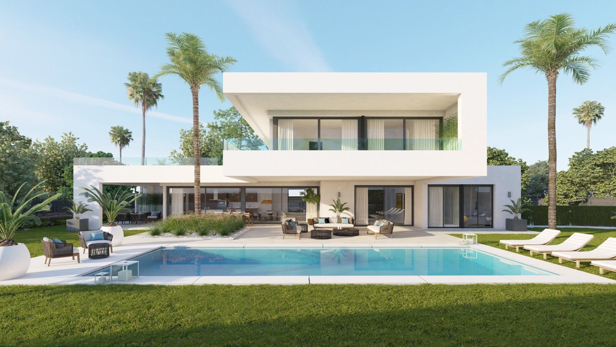 Modern white villa with a large swimming pool, outdoor lounge area, and palm trees under a clear blue sky.