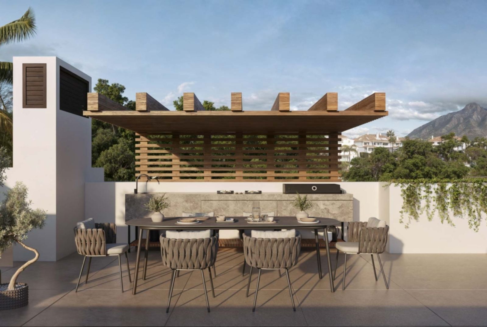 Noura Villas Sky: terras met eettafel en buitenkeuken.