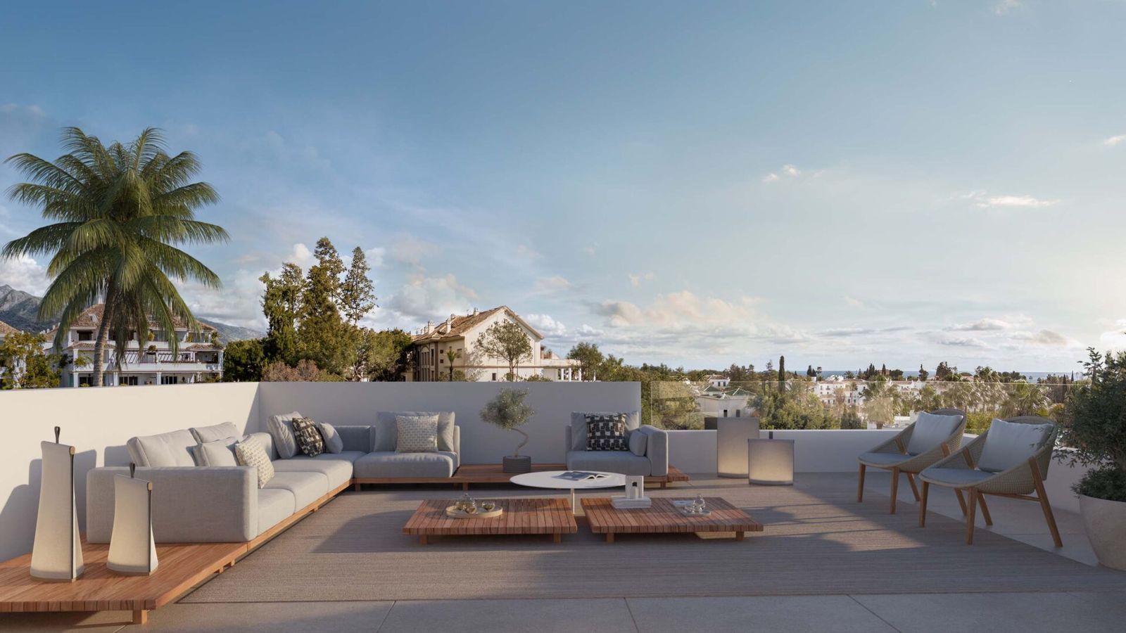 Noura Villas zonneterras met lounge meubels en uitzicht.