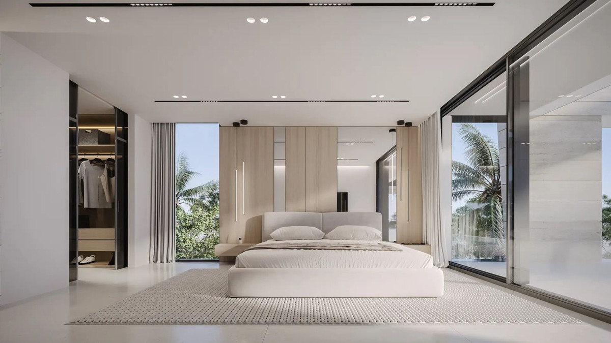 Moderne slaapkamer met minimalistisch design en uitzicht op de natuur.