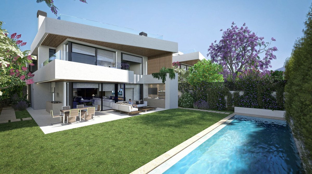 Modern villa with outdoor living spaces, swimming pool, lush garden, and flowering trees.