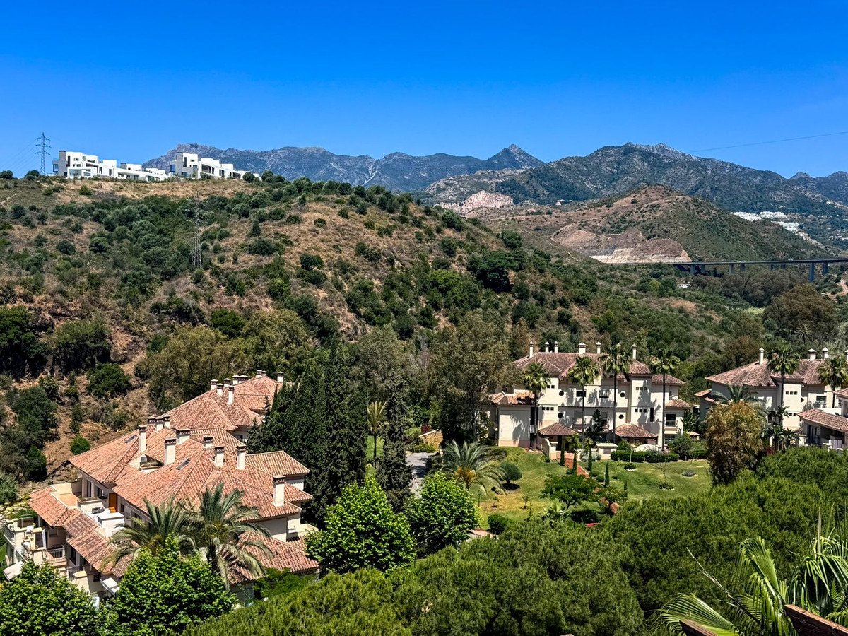 Elegant villas nestled in lush greenery, offering stunning mountain and landscape views.