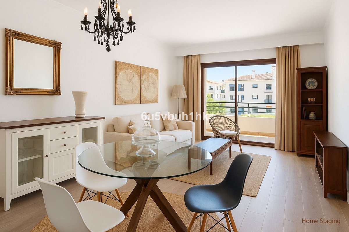 Modern living and dining room with glass table, sofa, and balcony view