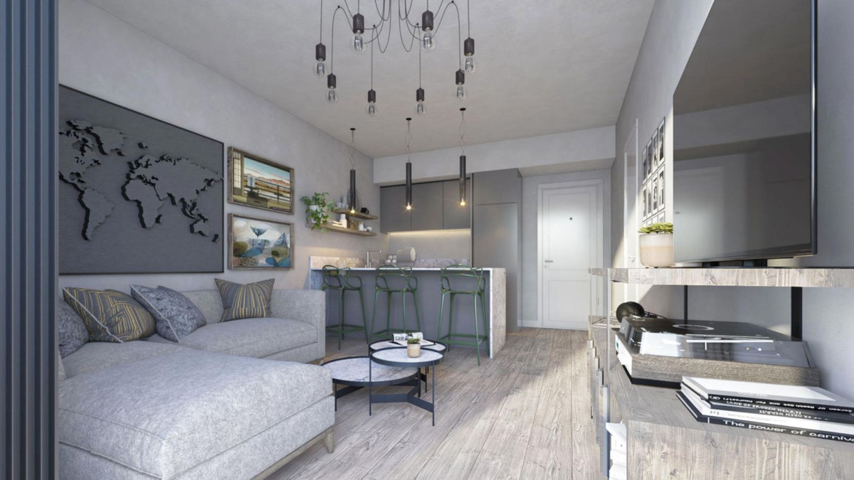 Modern appartement interieur in Mijas met open keuken en comfortabele woonkamer.