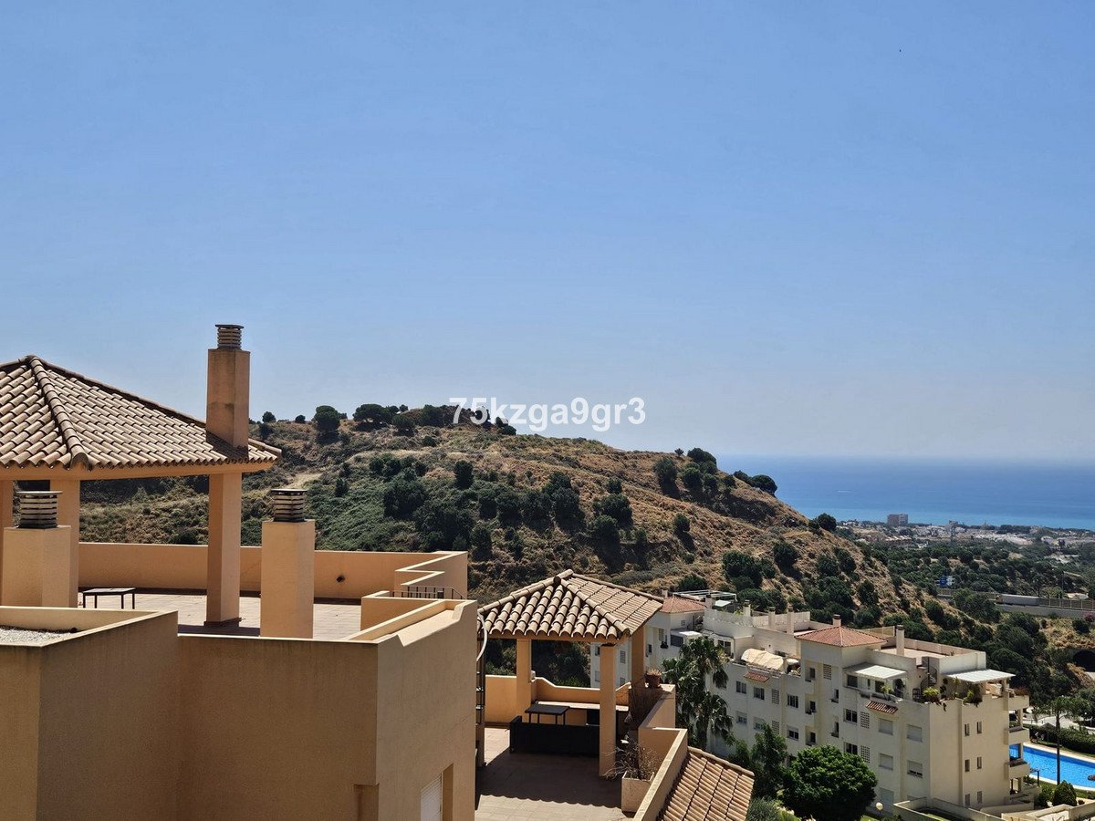 Rooftop terrace with sea view and surrounding buildings