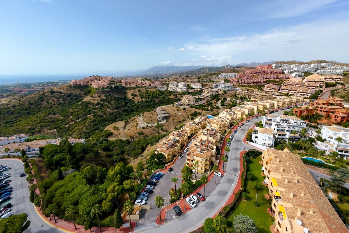 Aerial view of a residential complex with sea and mountain views