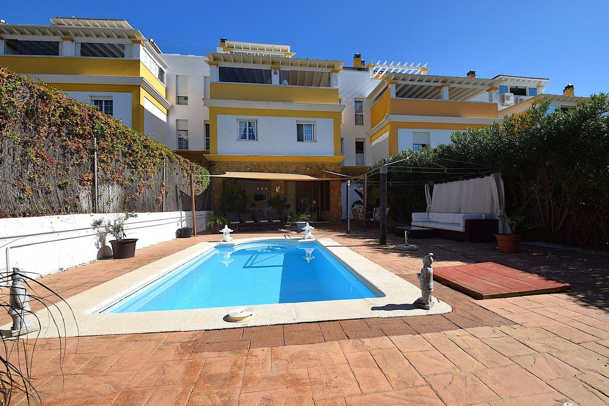 Villa with swimming pool, outdoor seating, and covered terrace area