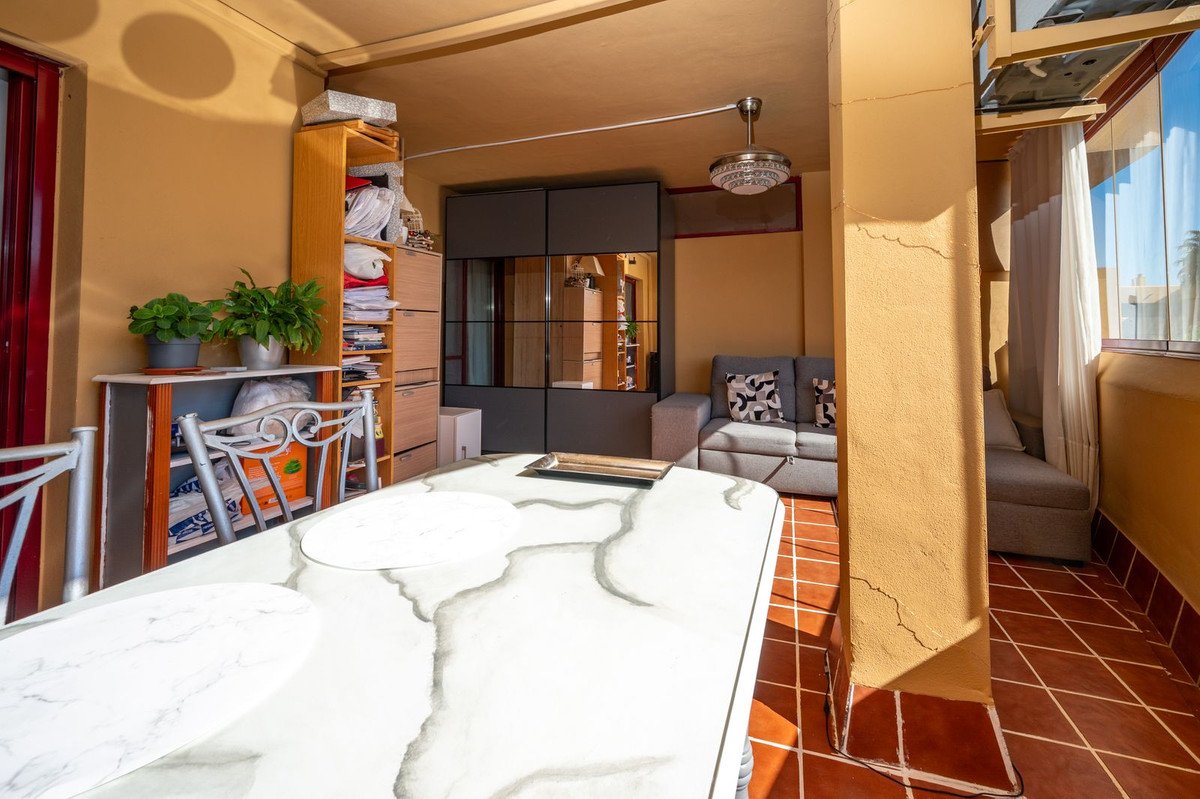 Apartment living and dining area with outdoor terrace view