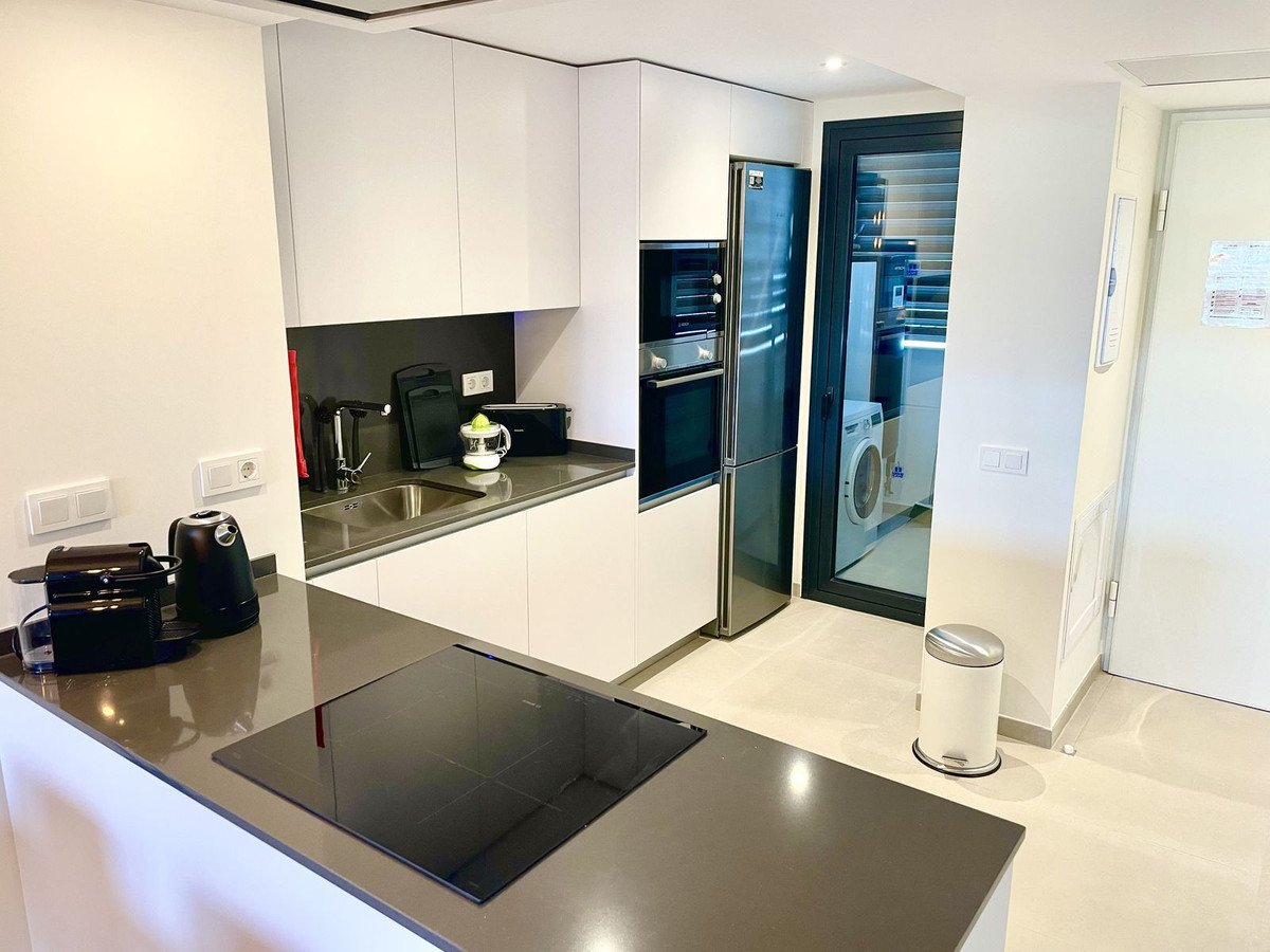 Modern kitchen with stainless steel appliances and sleek countertops