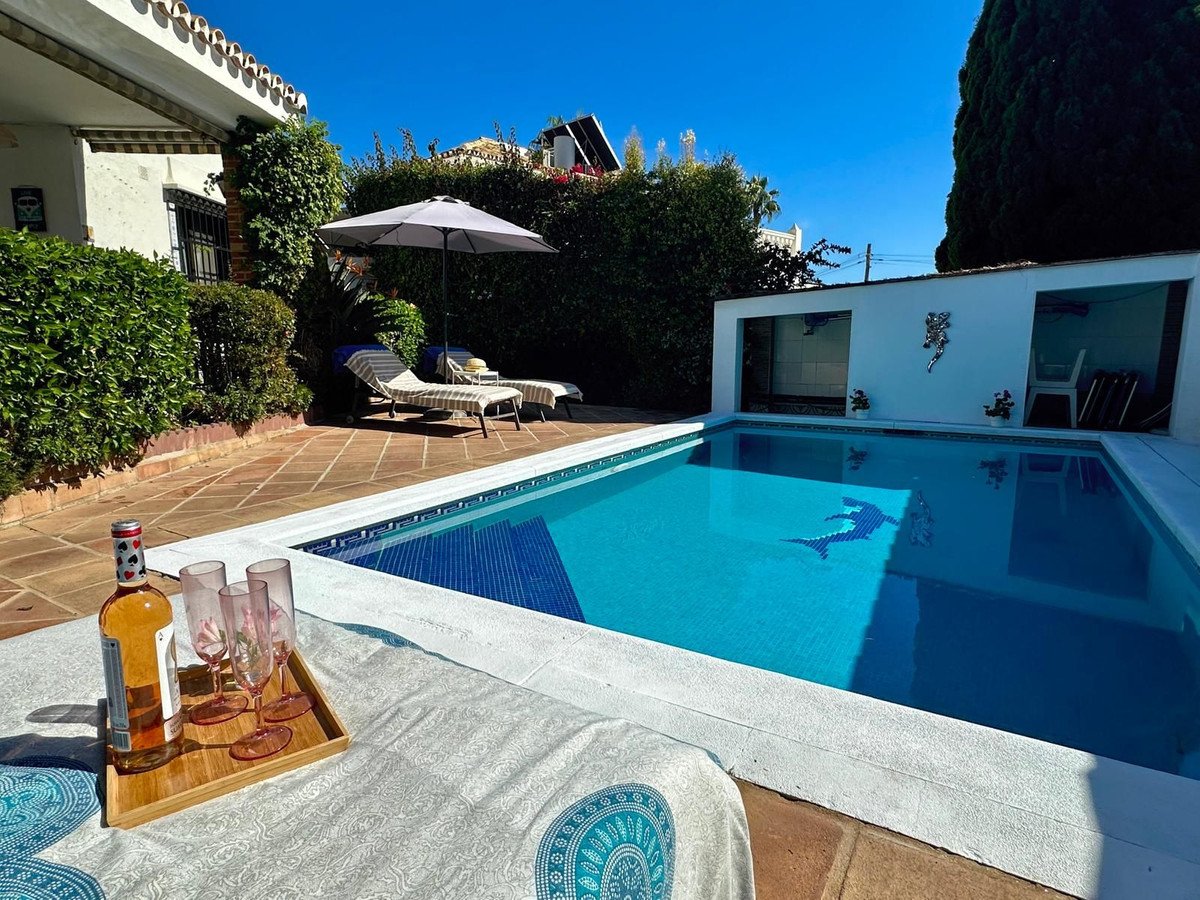Private pool with patio, sun loungers, and outdoor seating area