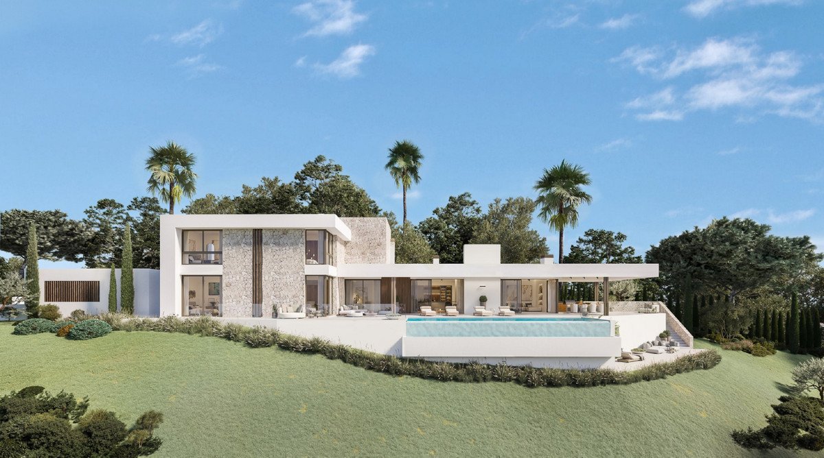 A modern white villa with an infinity pool, surrounded by lush greenery and palm trees under a blue sky.