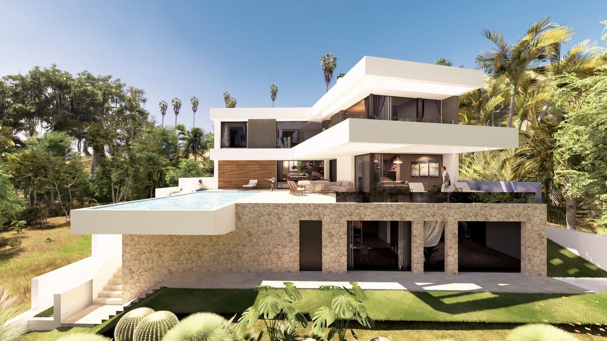 Modern luxury villa with infinity pool, surrounded by lush tropical vegetation and palm trees under a clear blue sky.