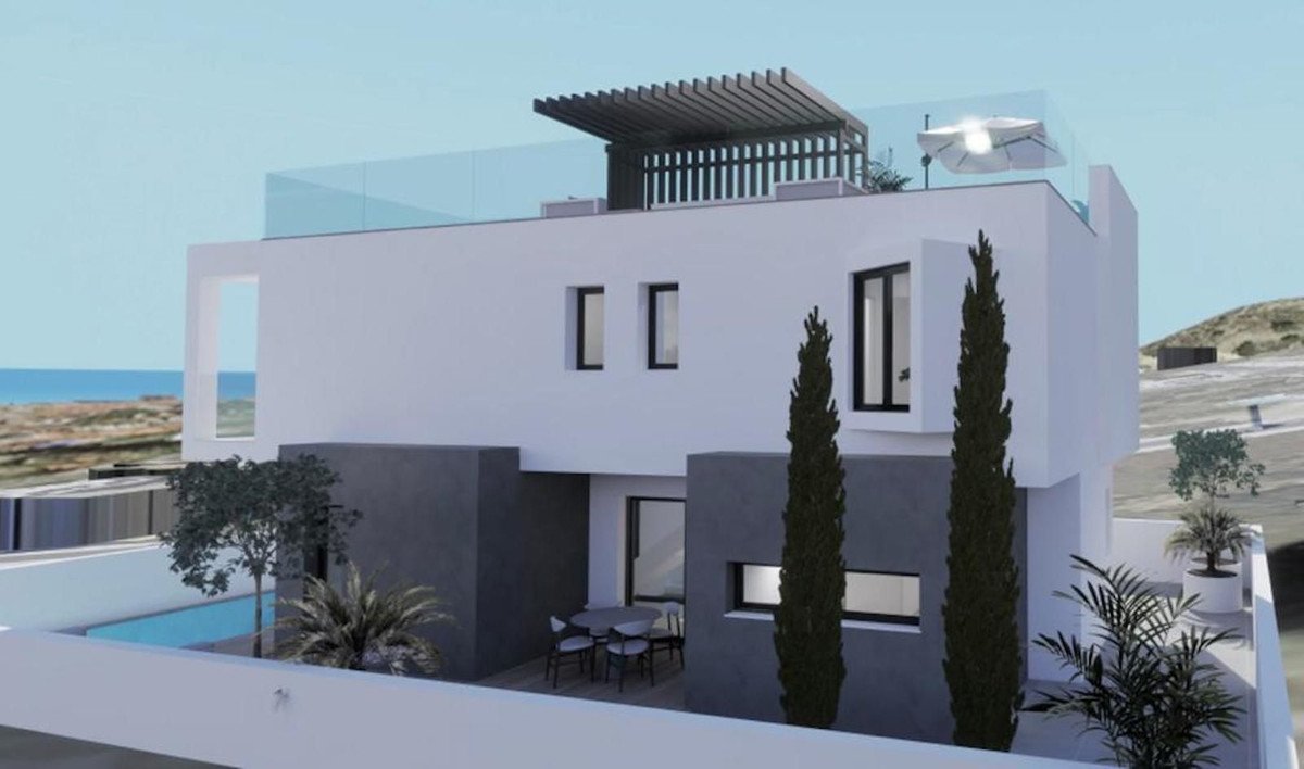 Modern villa with a private pool, outdoor dining area, rooftop terrace with sea views, and lush landscaping.