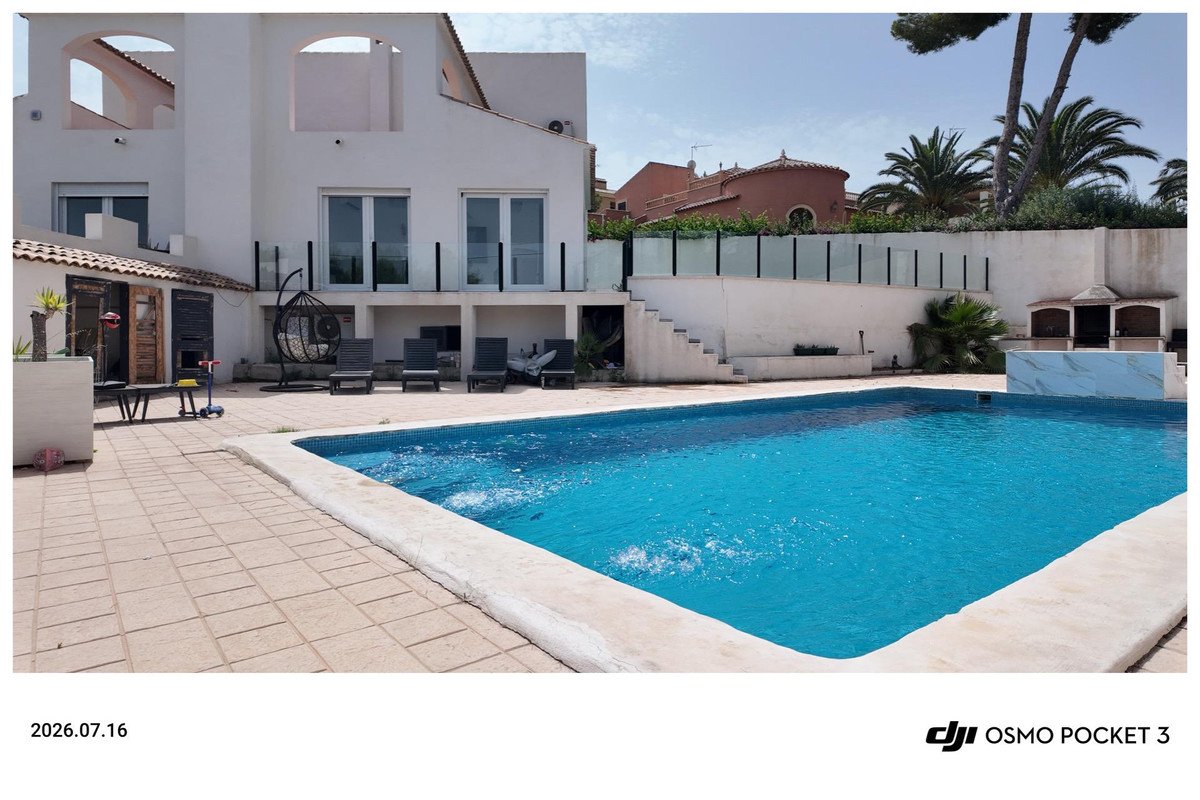 Villa with swimming pool, outdoor lounge, and patio area with seating
