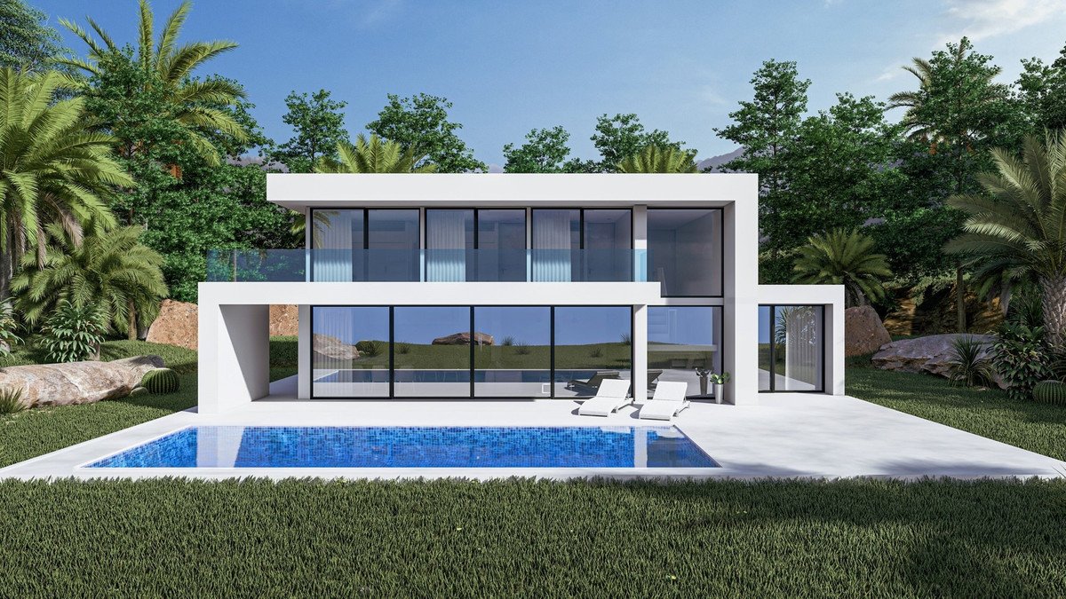 Modern white villa with a swimming pool and lounge chairs, surrounded by a lush tropical garden.