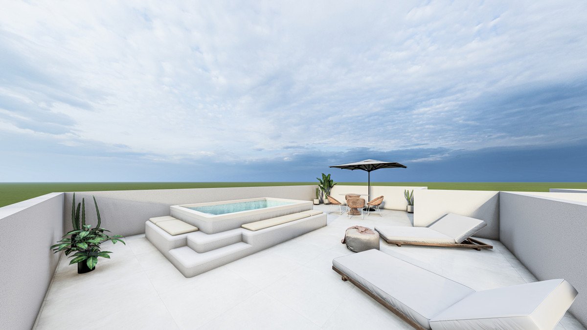 Modern terrace with a built-in jacuzzi, lounge chairs, dining table, and umbrella under a cloudy sky.