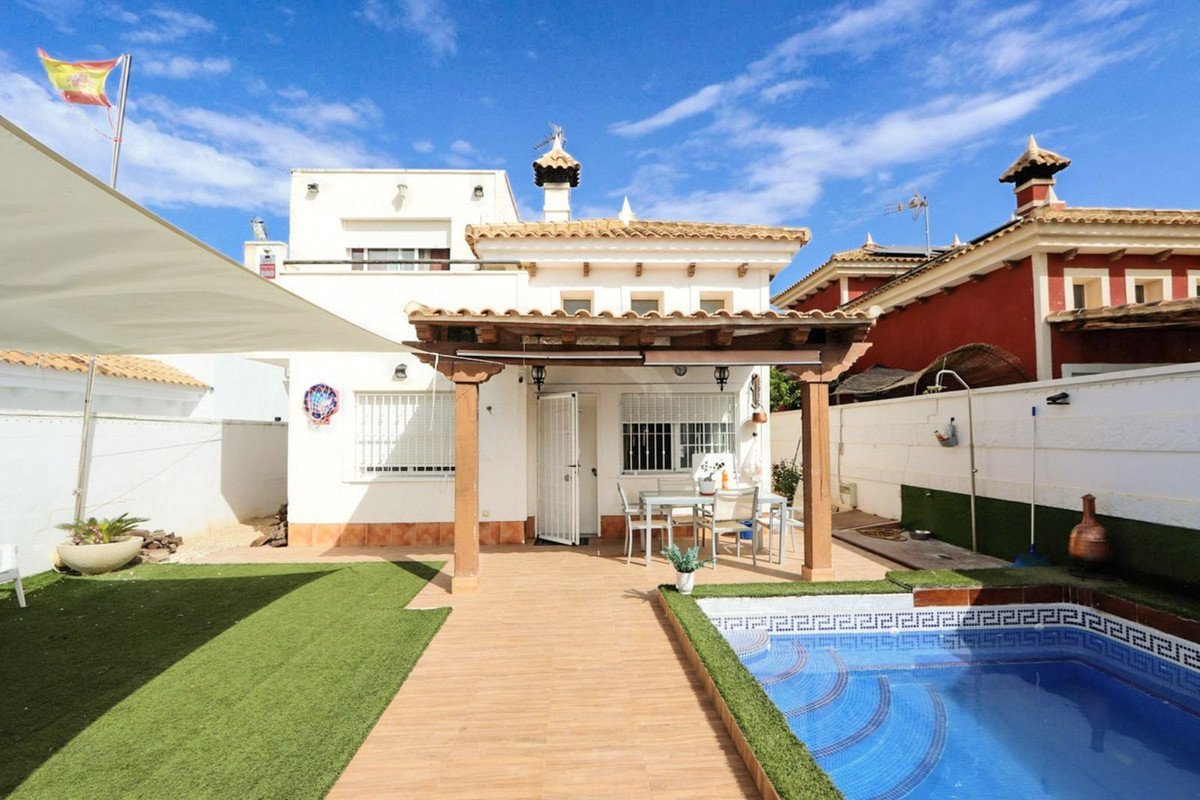 Luxurious swimming pool yard with white walls and wooden pergola
