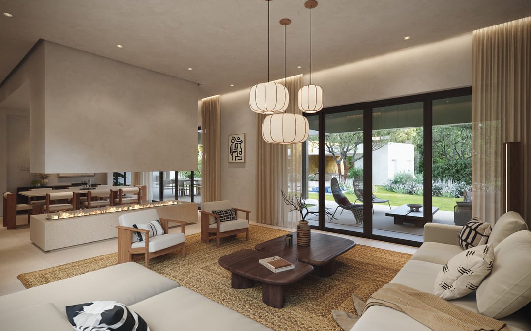 Modern living room with a long fireplace, stylish furniture, and large glass doors opening to a green garden.