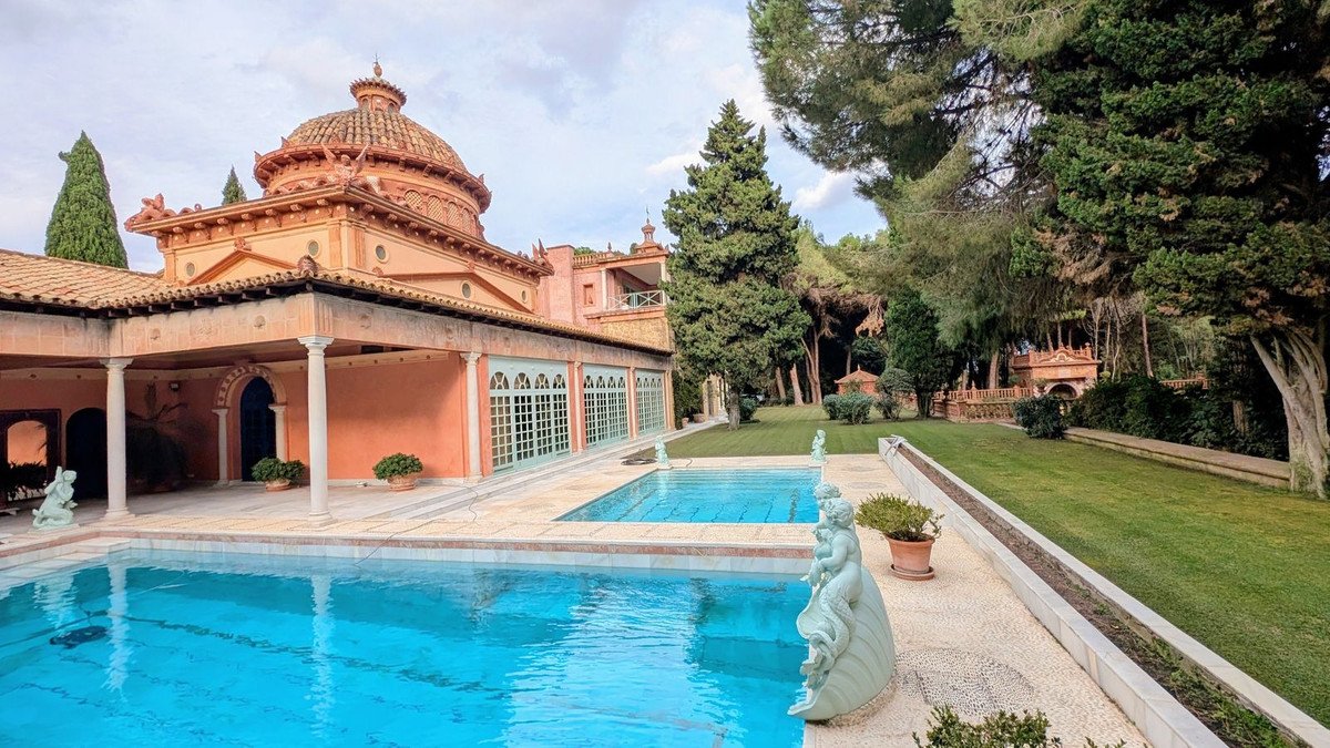 Villa with swimming pool and garden, outdoor space with statues