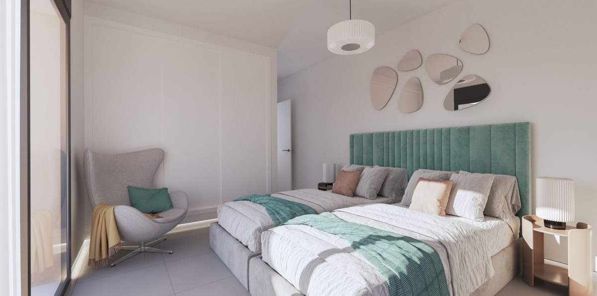 Moderne slaapkamerinterieur met twee bedden en een fauteuil