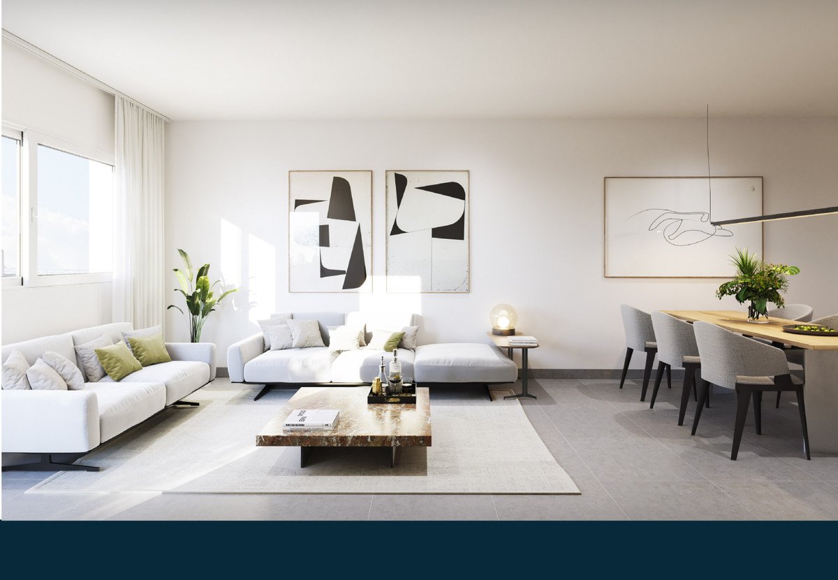 Moderne stue med hvid sofa, abstrakt kunst og spiseafdeling.